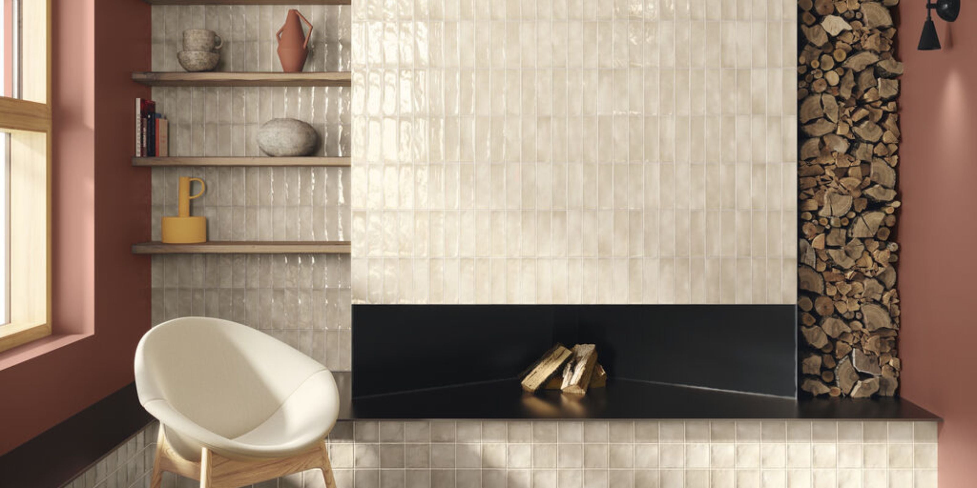 Modern cozy living space with tiled fireplace, stacked firewood, and cream lounge chair.