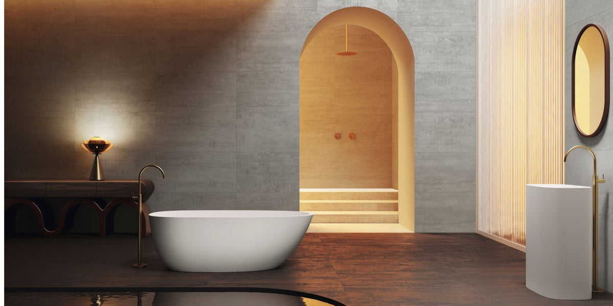 Modern sleek open plan bathroom with light large format tiles and tinted orange ambient lighting