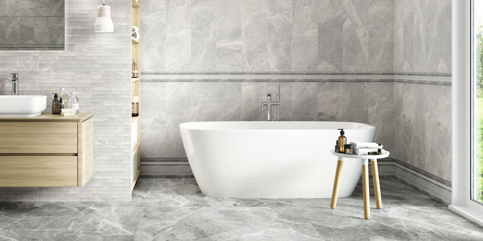 Grey aesthetic bathroom with light grey large format floor tiles and a white freestanding bath tub
