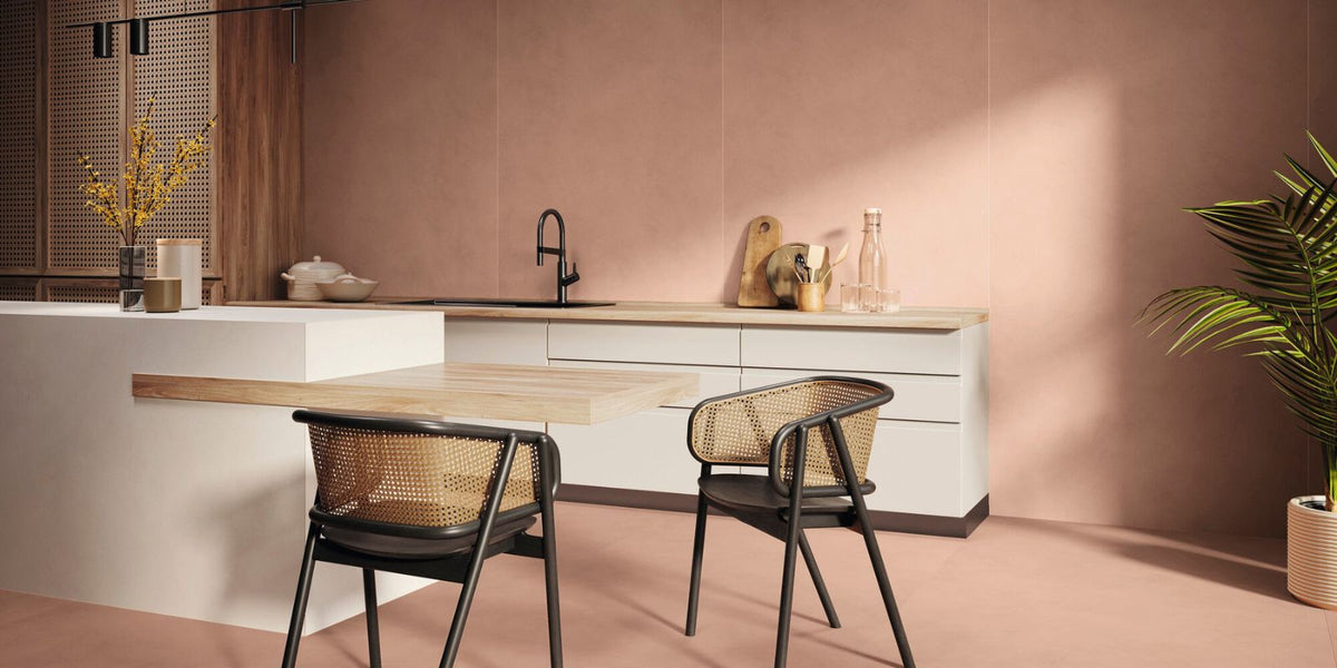 Pink aesthetic kitchen with white worktops and brown oak cabinets