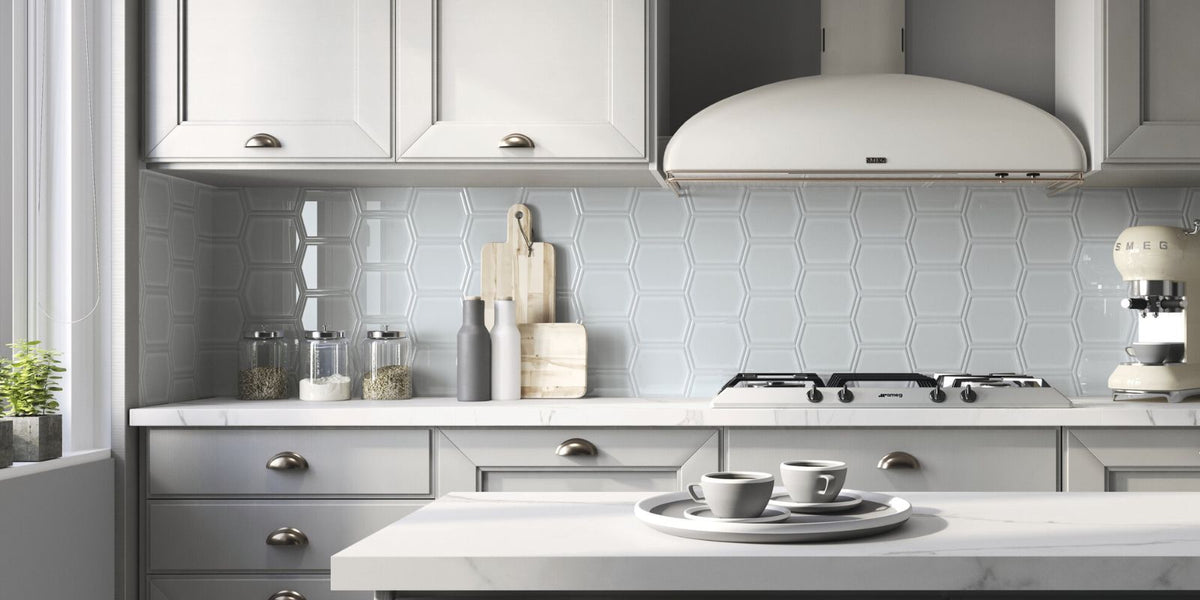 modern grey kitchen with sleek cabinets, marble counters, and geometric backsplash tiles, creating a clean and stylish look.