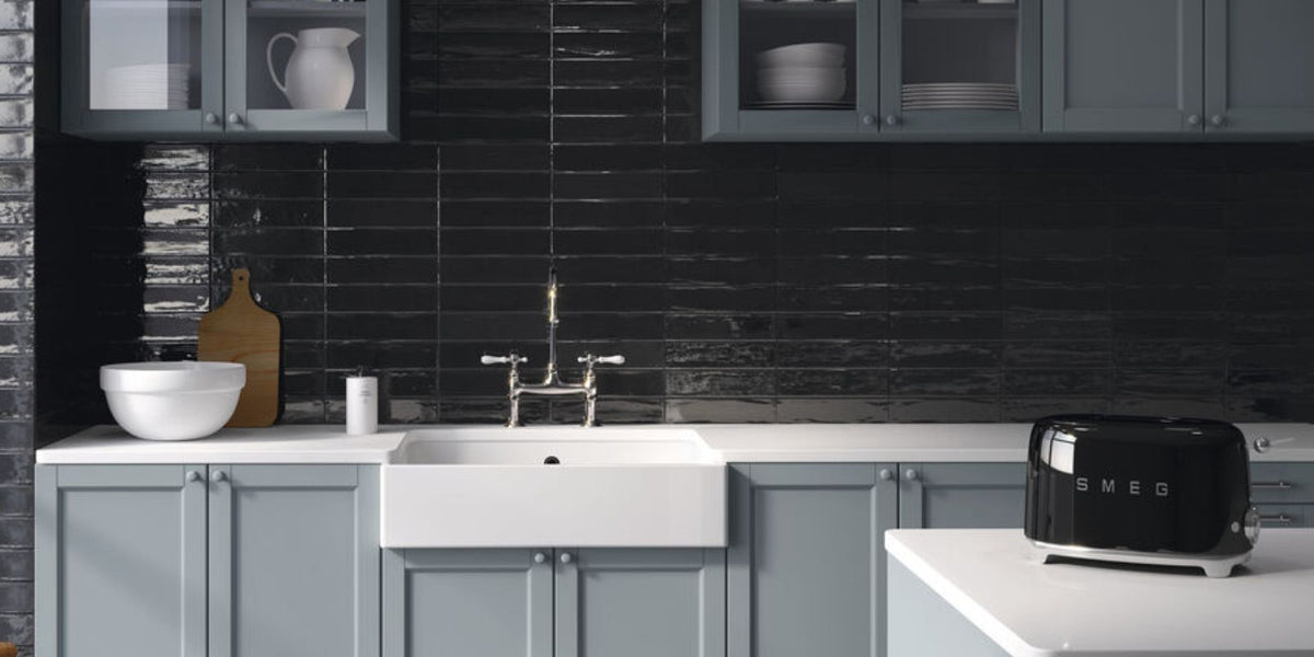 black and blue contemporary kitchen with sleek white worktops