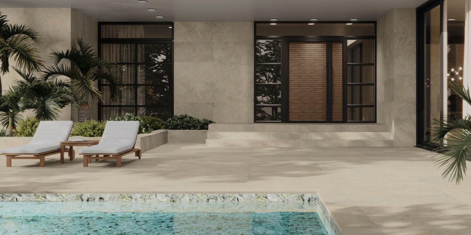 Beige large format outdoor tiles with black large windows and cream sunlounges by a teal pool.