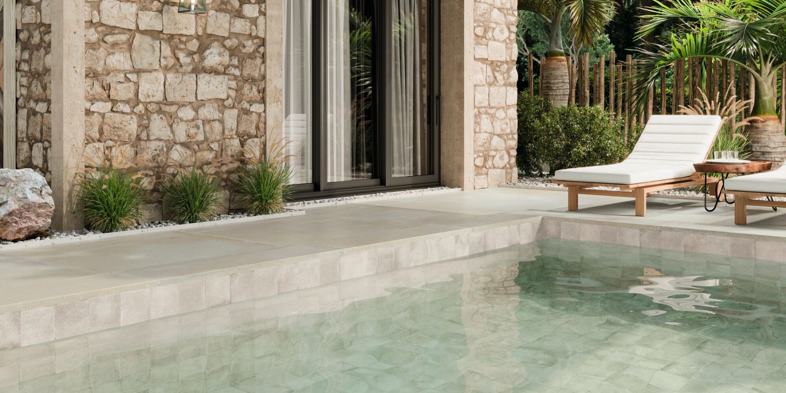 Mediterranean aesthetic outdoor area with pool. Cream porcelain floor tiles and brick look wall tiles.