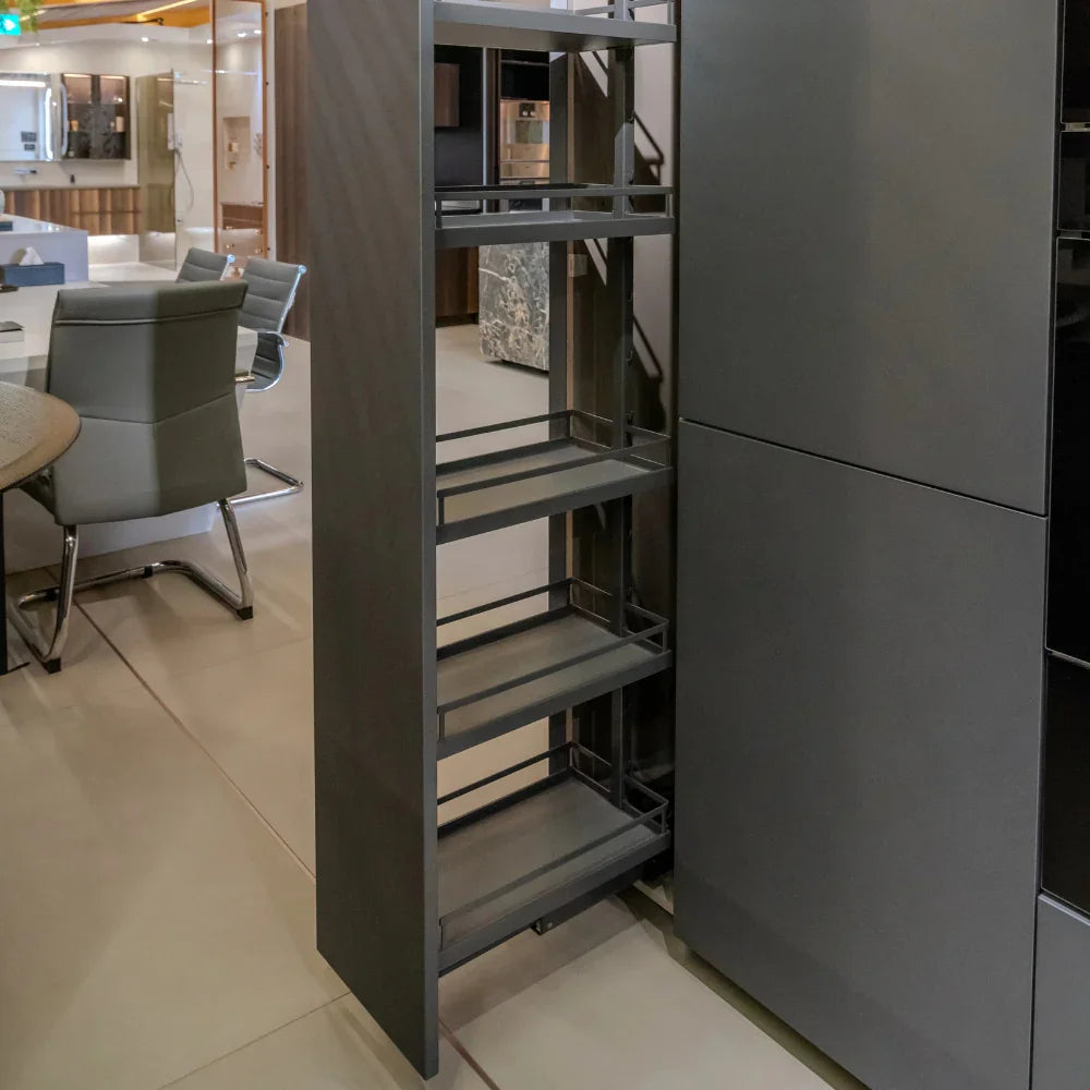 Modern kitchen with a tall grey cabinet with pull-out shelves.