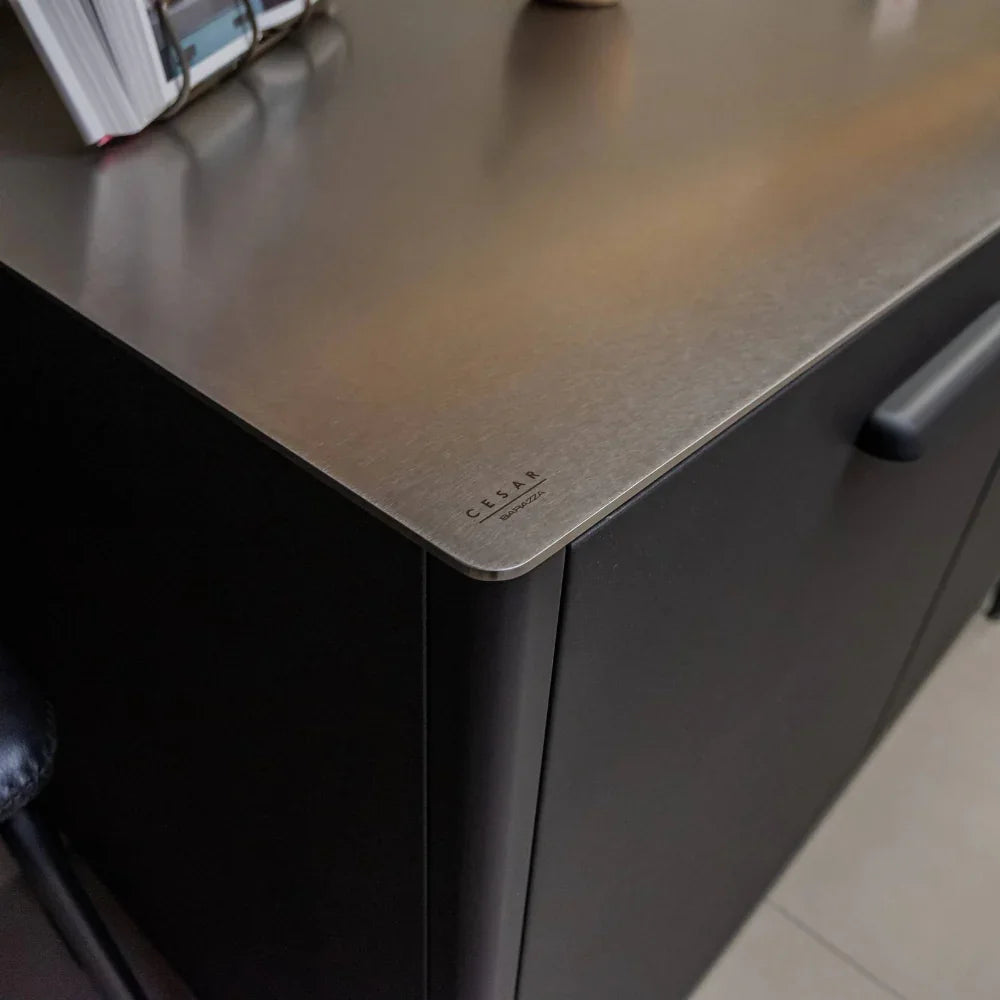 Close-up of a kitchen worktop with a visible brand name.