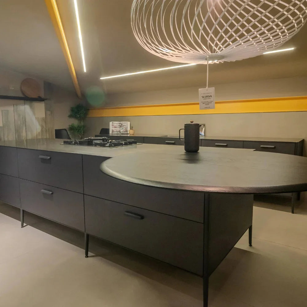 Modern kitchen with grey island and yellow accent wall