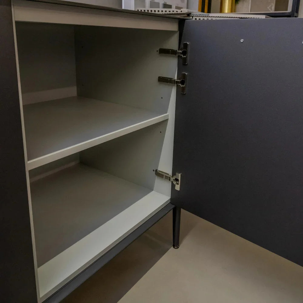 Grey cabinet with open door revealing empty shelves.
