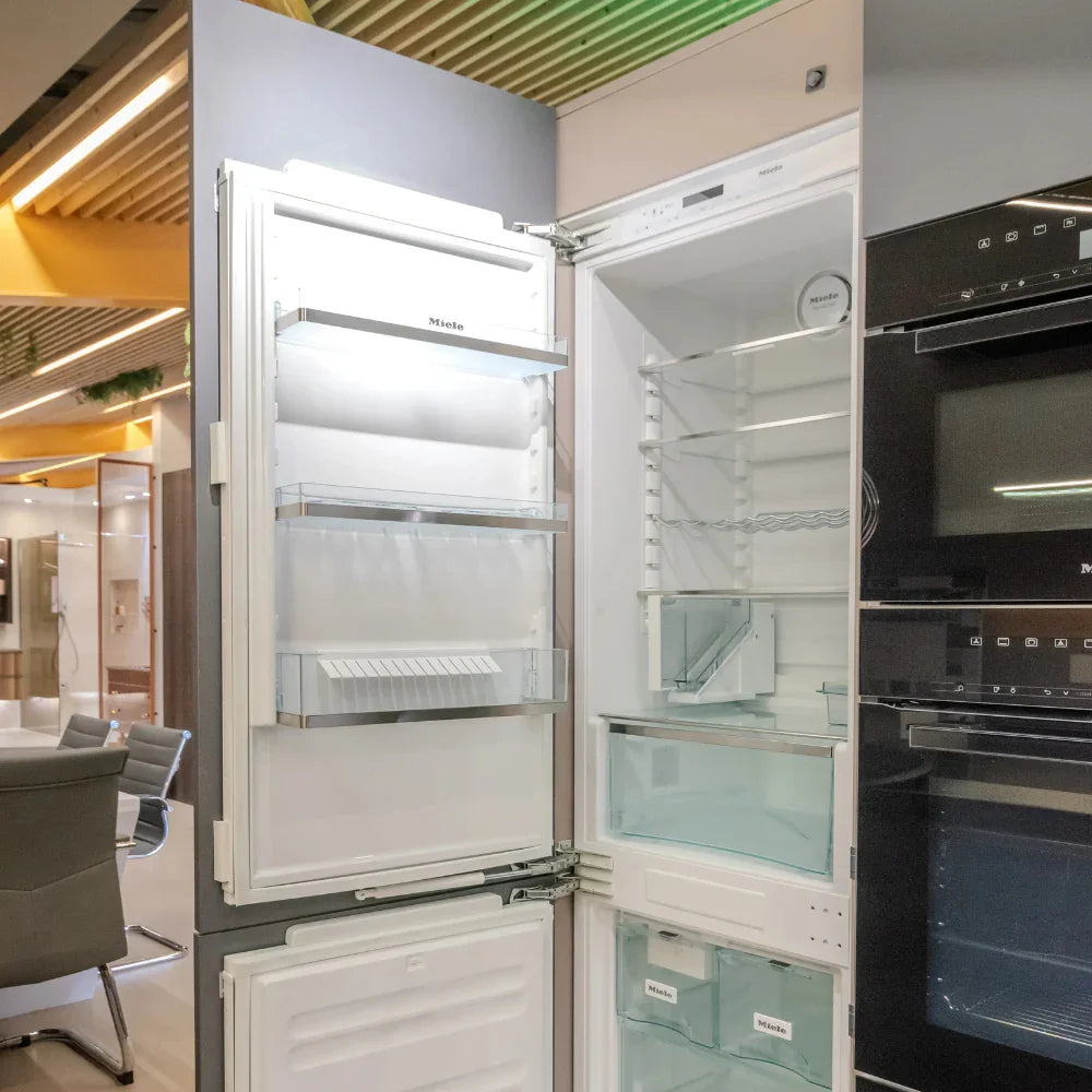 Modern kitchen with open refrigerator and oven