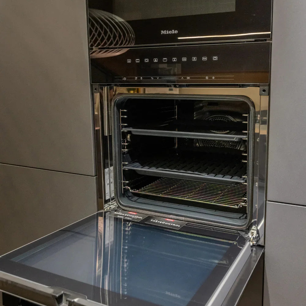 Miele oven with open door in a kitchen setting