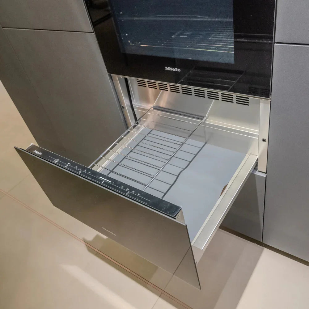 Miele oven with an open door showing the interior and racks.