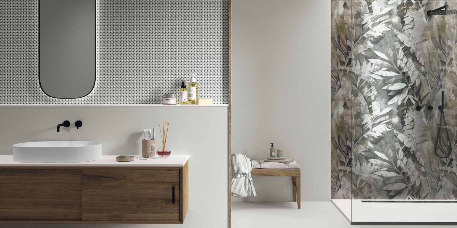 Modern bathroom with wood vanity, round basin sink, backlit mirror, and a tropical leaf-patterned shower wall.