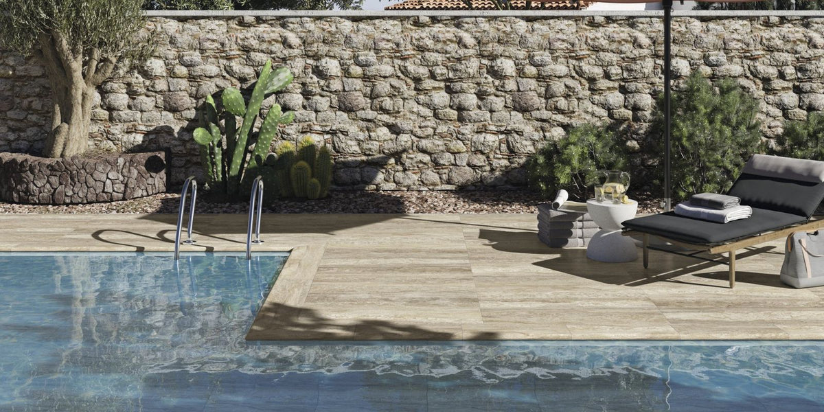 Wood effect outdoor herringbone tiles creating a warm and inviting garden area and pool. . 