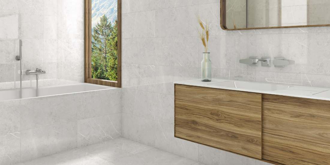 grey wall and floor bathroom tiles in a bathroom with mountain views