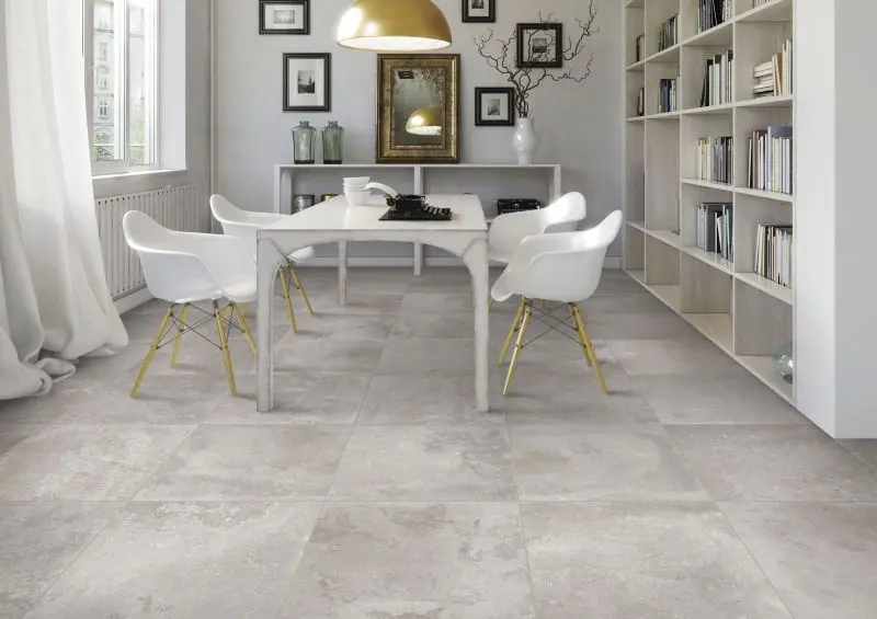 White large format floor tiles in a dining area