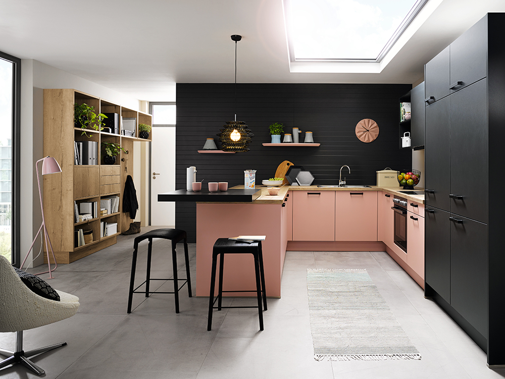 Pink and black modern kitchen interior with wooden details