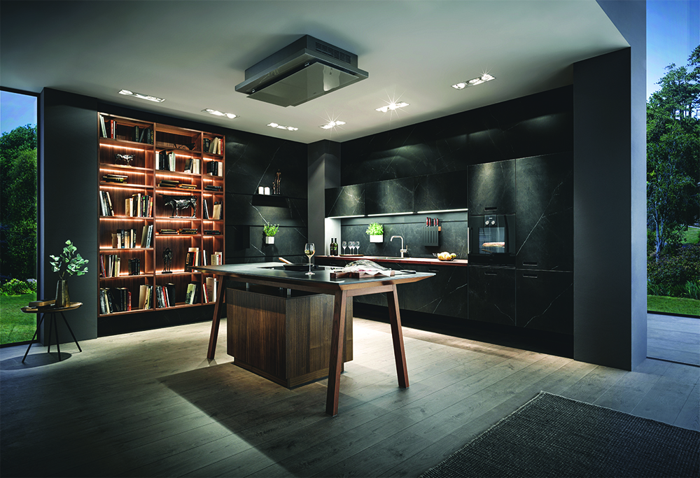 Modern kitchen interior with dark and moody colour scheme and wooden features