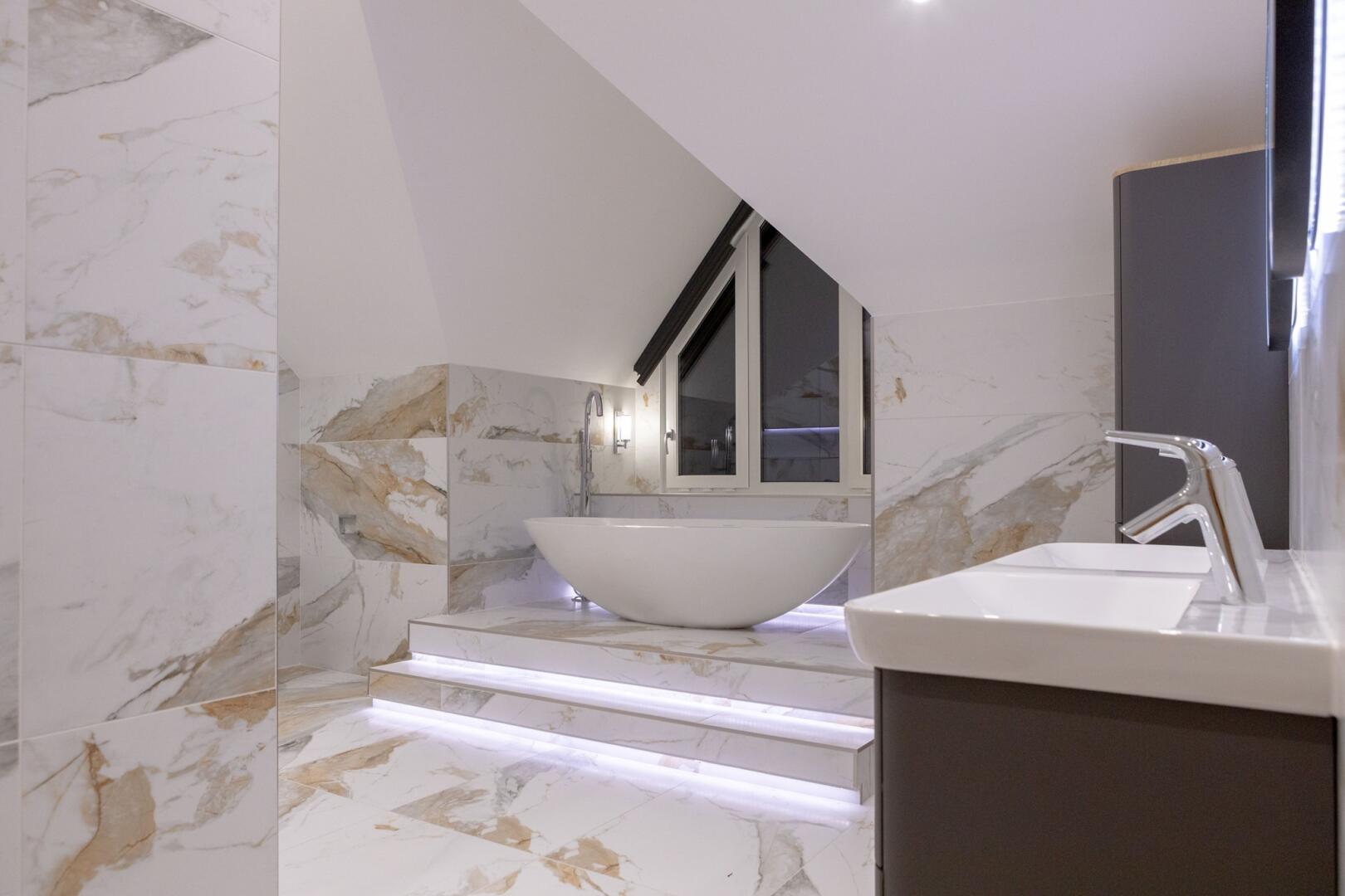 Marble tiles used to separate areas in a bathroom