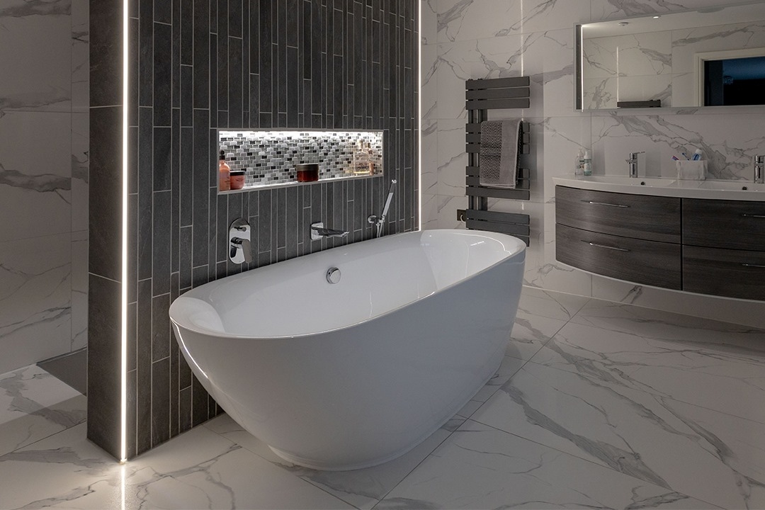 Small and large tiles used to create a feature wall in a bathroom