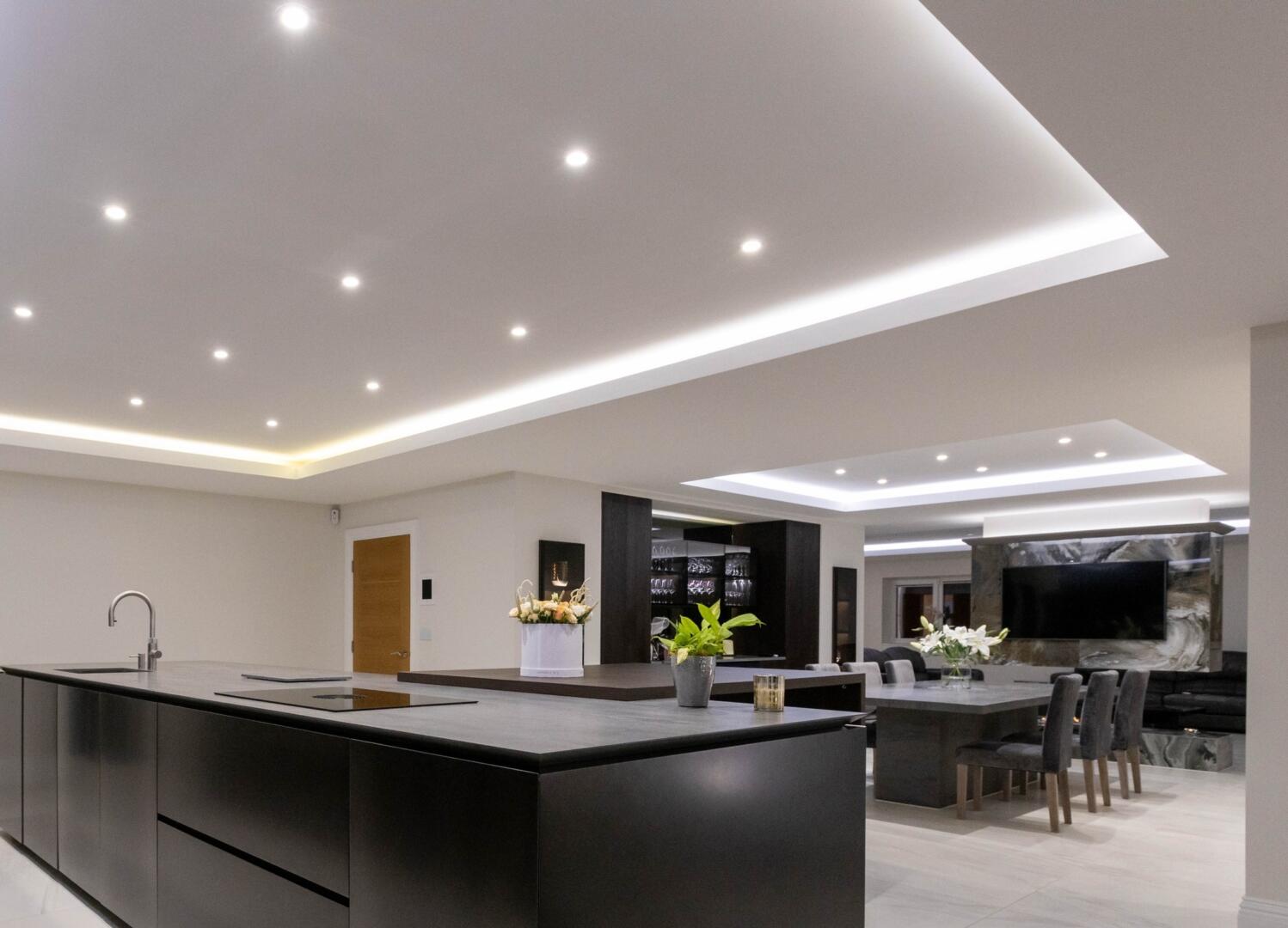 Brilliant bright LED spotlights built into modern open plan ceiling