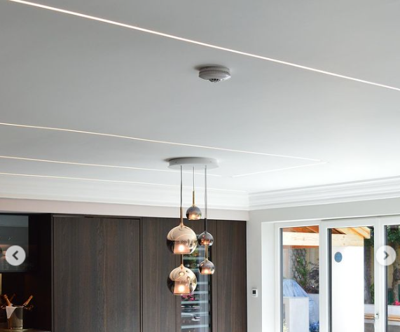 Modern LED strip lighting built into kitchen ceiling