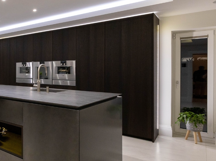 LED strip lighting built into modern kitchen cabinets 