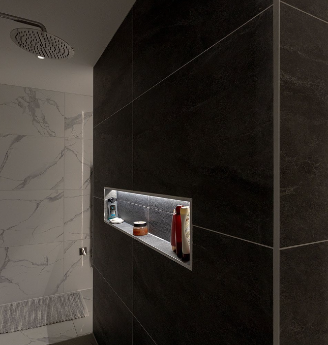 Sunken shelves with LED strip lighting in a modern walk-in shower