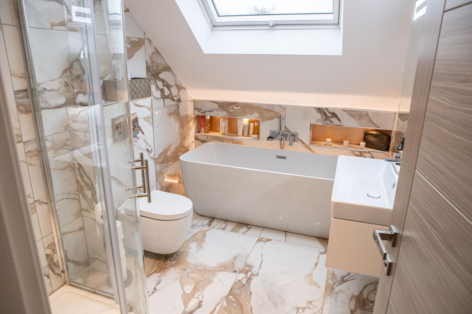 Stunning marble four piece bathroom with hidden LED lights