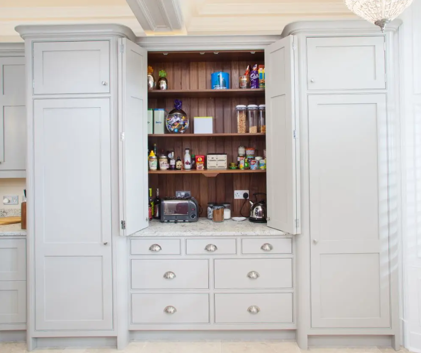 Stunning classic English hidden pantry by Jacob and Sons