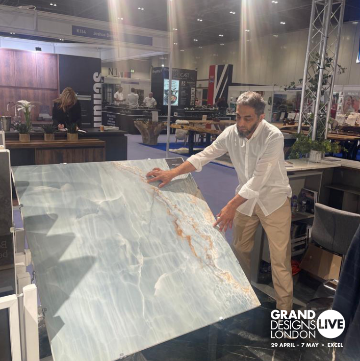 A member of team Roccia showcasing luxury large format marble tiles