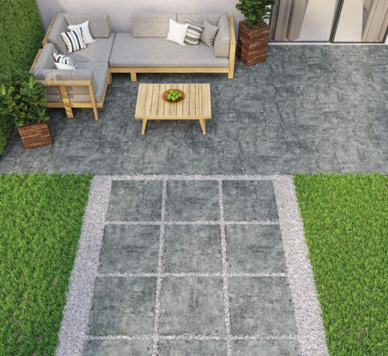 Concrete effect outdoor tiles creating a path and patio in a modern garden