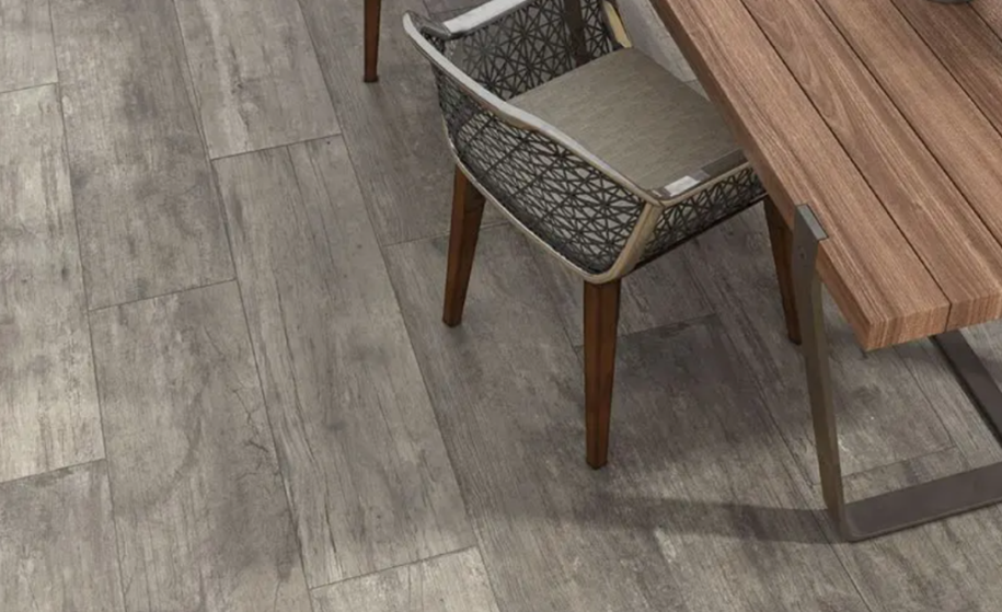 wood effect tiles with a dining table and chairs on top