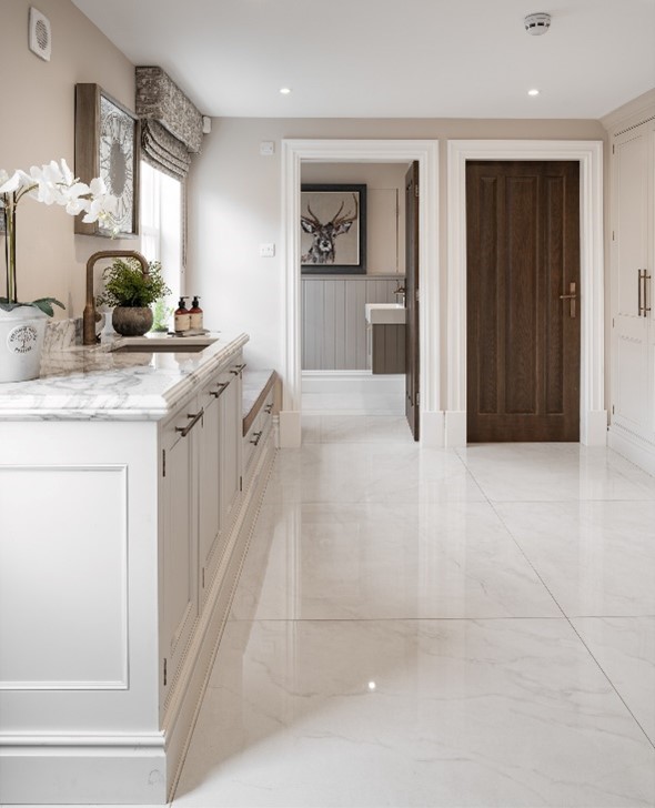 looking into kitchen with high-gloss marble large format tiles