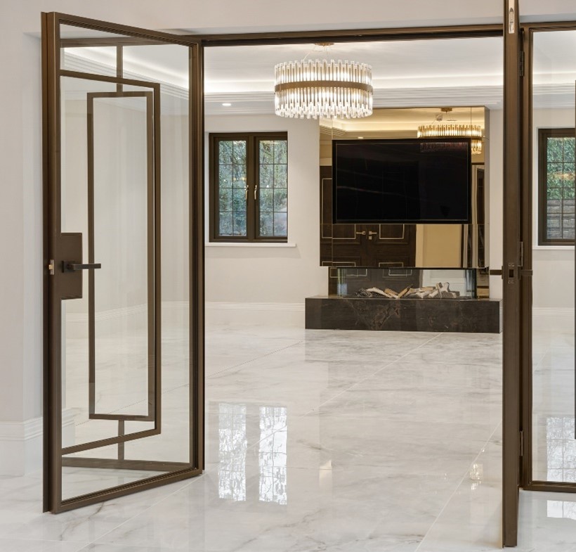 looking into living room with large format white high-gloss marble tiles and glass interior doors